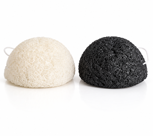 Natural konjac facial sponge duo, white and black charcoal, on a white background